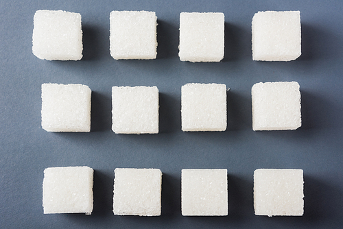 White sugar cube sweet food ingredient geometry pattern, studio shot isolated on a gray background, Minimal health high blood risk of diabetes and calorie intake concept