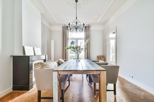 Elegant dining room with large table and comfortable soft chairs