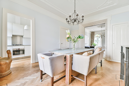 Elegant dining room with large table and comfortable soft chairs