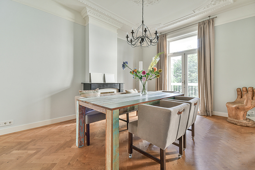 Elegant dining room with large table and comfortable soft chairs