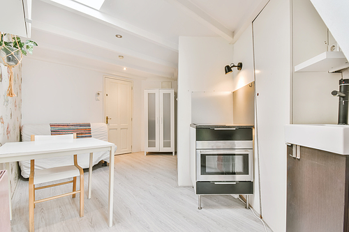 Bright room with a miniature white table and chair