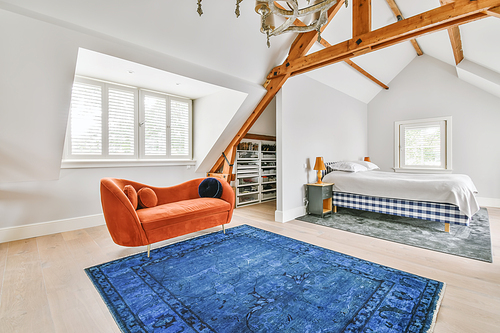 Cozy bright room with a bright red sofa in the middle