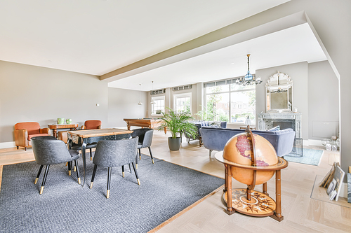 Stunning dining room with plush comfy and padded chairs and a small table