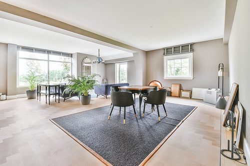 Stunning dining room with plush comfy and padded chairs and a small table