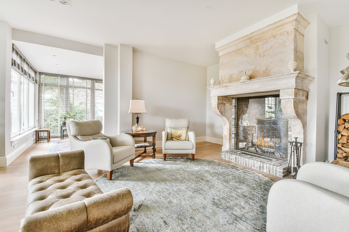 Luxurious living room with soft sofa and armchairs