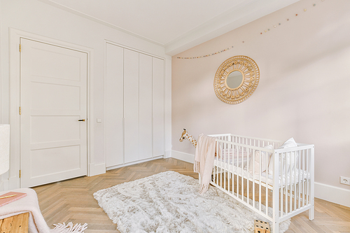 The interior of a children's room with a cot and matching designs in a modern house