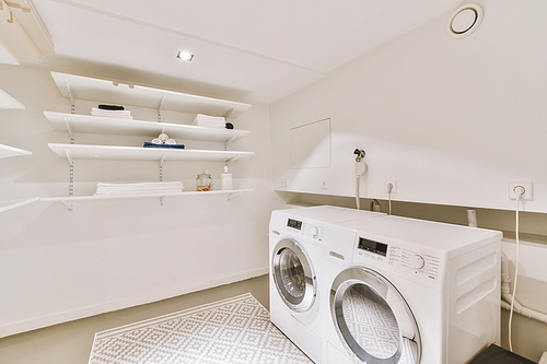 Interior of the laundry room with the corresponding things in a modern, cozy house