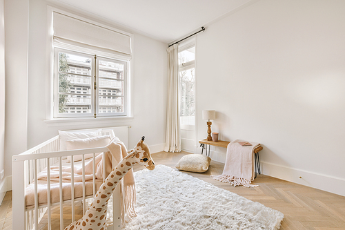 The interior of a children's room with a cot and matching designs in a modern house