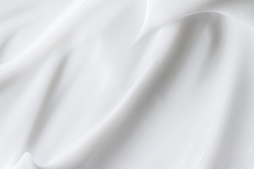 Pure white cream texture as abstract background, food substance or organic cosmetics