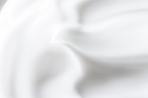 Pure white cream texture as abstract background, food substance or organic cosmetics