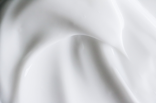 Pure white cream texture as abstract background, food substance or organic cosmetics