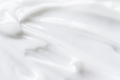 Pure white cream texture as abstract background, food substance or organic cosmetics