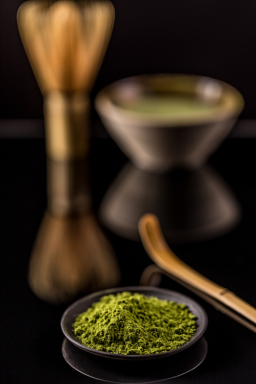 Powder green tea, matcha in black plate