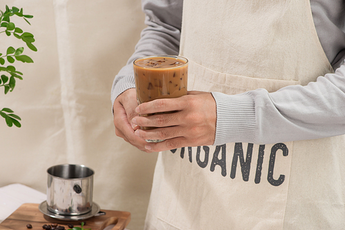 Ice coffee with fresh coffee on a wooden background, Coffee with milk and ice on natural wooden