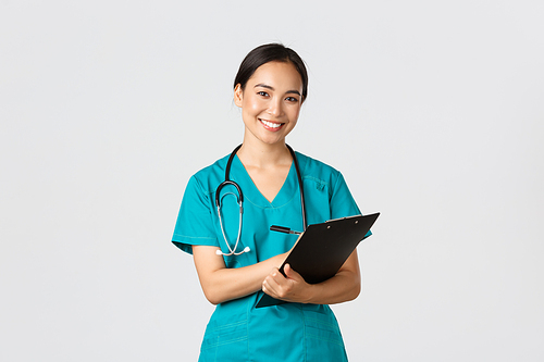 Healthcare workers, preventing virus, quarantine campaign concept. Cheerful friendly asian female physician, doctor with clipboard during daily checkup, standing white background.