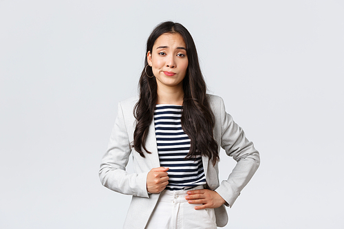 Business, finance and employment, female successful entrepreneurs concept. Arrogant and confident young asian businesswoman looking unimpressed, make skeptical smirk.