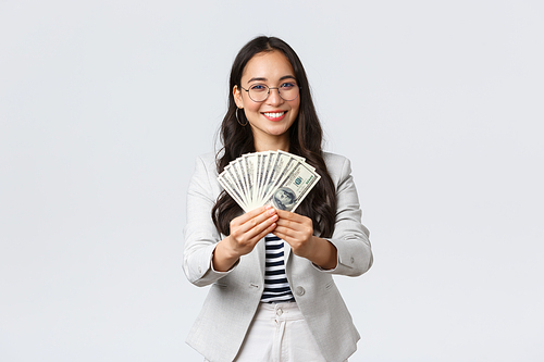 Business, finance and employment, entrepreneur and money concept. Businesswoman giving you cash, suggest good work with stable big income, smiling inviting for job in her company.