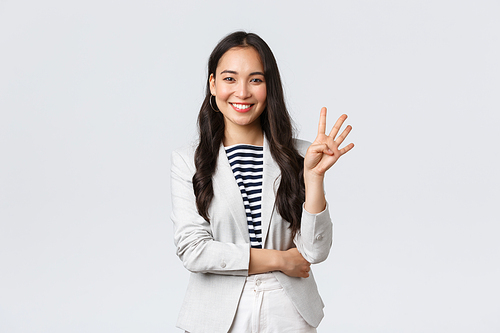 Business, finance and employment, female successful entrepreneurs concept. Successful female businesswoman, asian real estate broker pointing finger, showing number four and smiling.