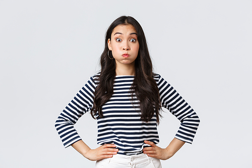 Lifestyle, people emotions and casual concept. Confused cute and puzzled girl pouting, searching for solution, holding breath and staring questioned camera, white background.