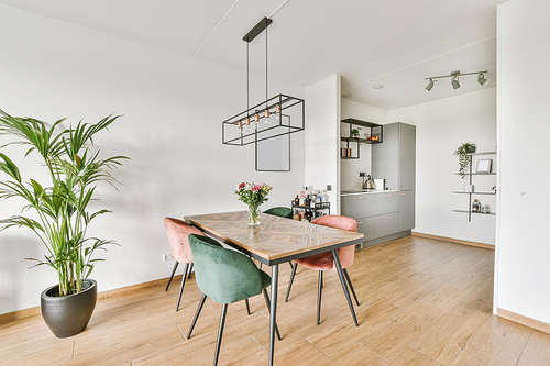 Stunning dining area for four with pink green velvet chairs