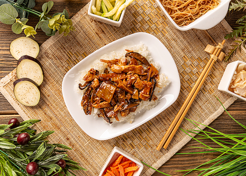 Chinese foog, rice with bamboo shoots served on white plate