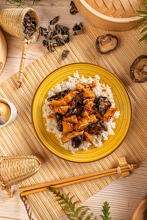 Top view of rice with ear wood mushrooms, chicken breast and bamboo