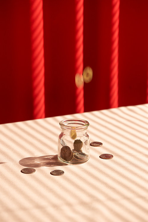 Coins in glass jar. Money savings concept