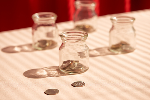 Coins in glass jar. Money savings concept