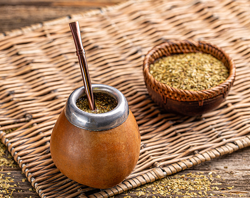 Traditional Argentinian yerba mate tea in a calabash gourd with bombilla stick