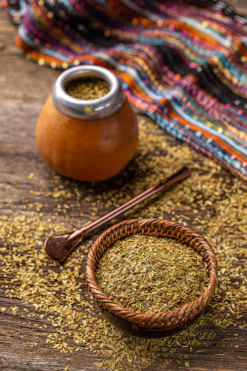 Traditional South American yerba mate leaves and tea served in the calabash