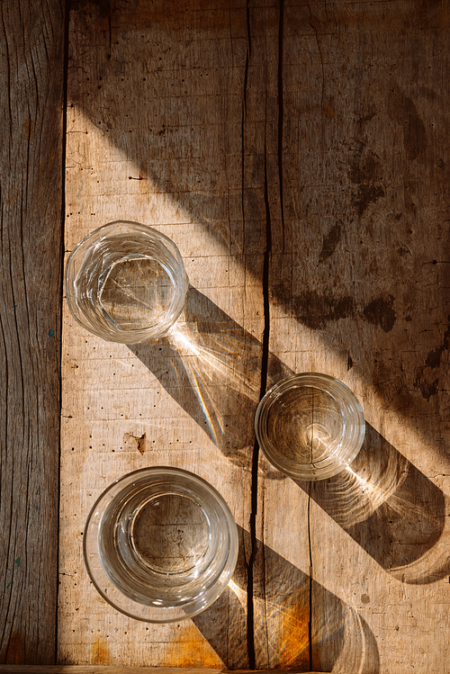 Drink a glass of water on a wooden floor.