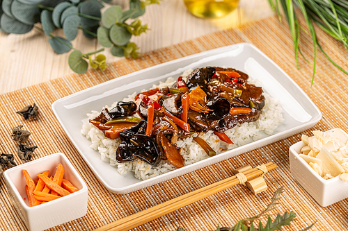 Chinese style menu, stir fry vegetables with shiitake and bamboo shoots served with boiled rice