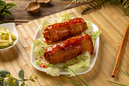Fresh fried Chinese spring rolls food with green salad
