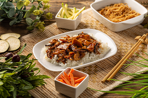 Chinese rice food with chicken and pices of bamboo shoots