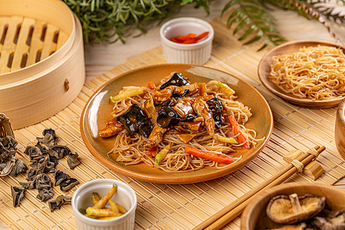 Noodles stir fry with ear wood mushrooms and vegetables