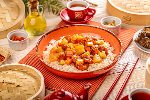 Pineapple and chicken in sweet and sour sauce. Traditional Chinese food