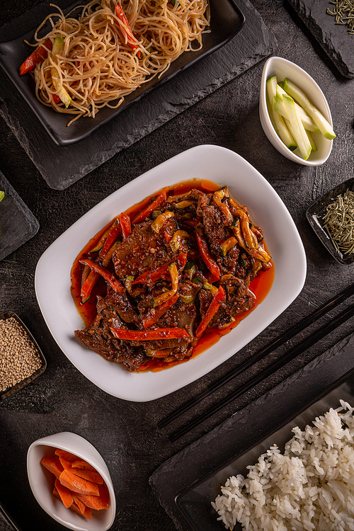 Chinese cuisine stewed pork tongue with paprika served with pasta and rice