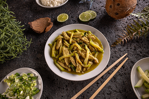 Stir fry chicken and zucchini prepared with cocos milk, Asian style cuisine