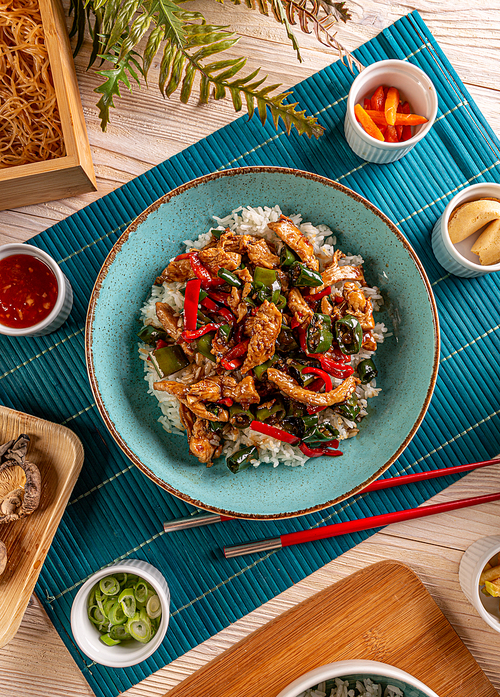 Stir fry chicken and peppers served with rice