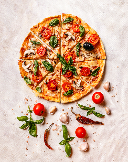 Fresh homemade pizza decorated with basil leaves