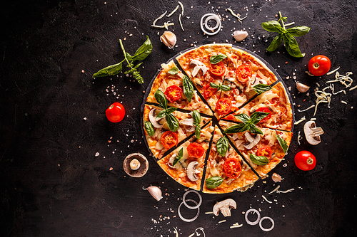 Tasty pizza with cherry tomatoes, onions and mushrooms on a black background
