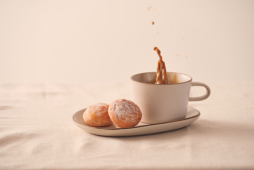 Morning coffee cup and sweet donut on white background