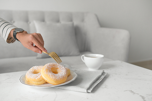 Classic donut. Morning breakfast on table in living room at home.
