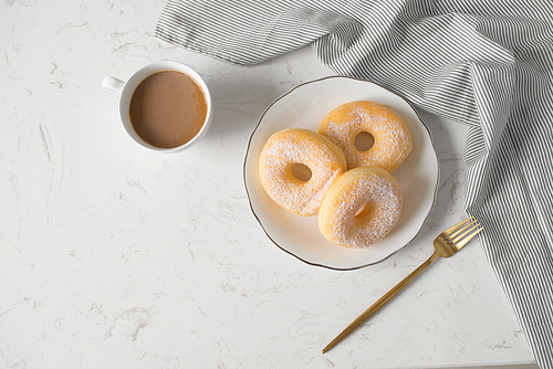 Classic donut. Morning breakfast on table in living room at home.