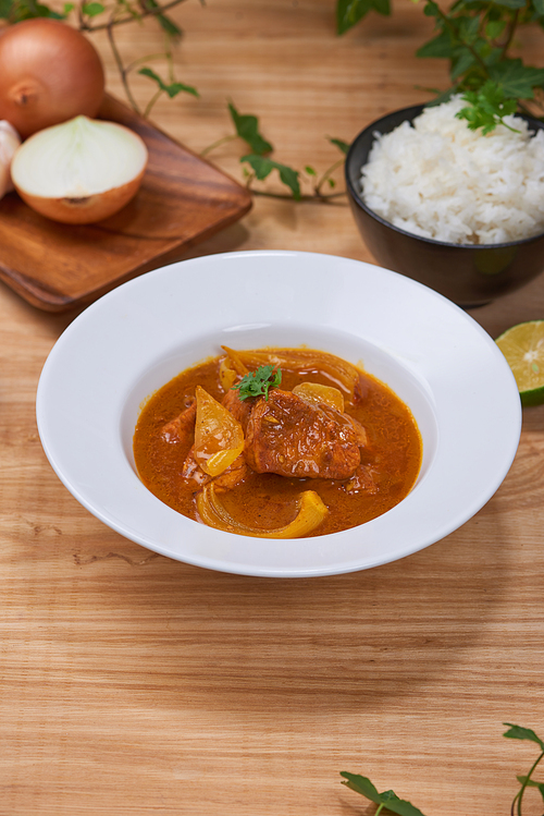 Chicken curry in a bowl / Vietnam chicken curry on wooden background