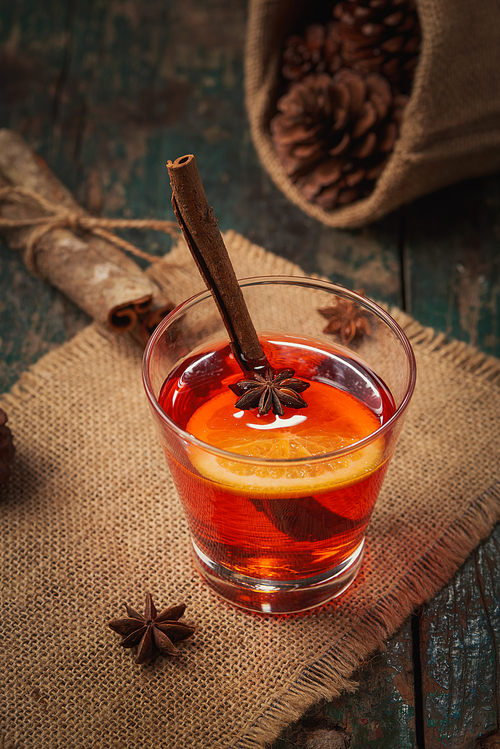 Christmas mulled wine on a rustic wooden table. Holidays concept.