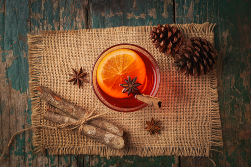 Christmas mulled wine on a rustic wooden table. Holidays concept.