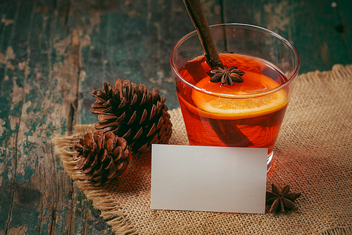 Christmas mulled wine on a rustic wooden table. Holidays concept.