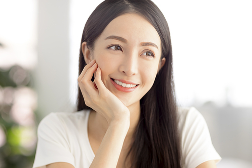 closeup  young asian woman face with clean  healthy skin