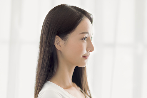 side view of beautiful young asian woman face with clean  healthy skin